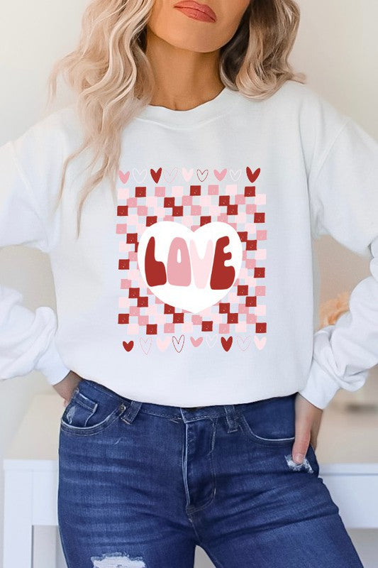 A female model wearing a white checkered pattern t-shirt with a heart and the word 'love' on the front.